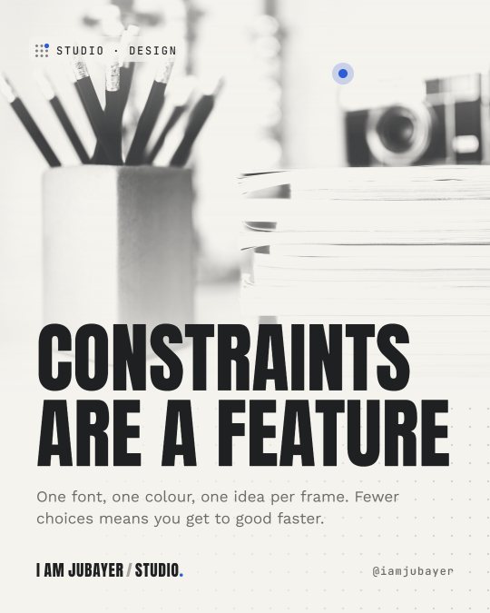 A grey pencil holder with black pencils beside a stack of notebooks, in black and white tones, with the headline: Constraints are a feature.